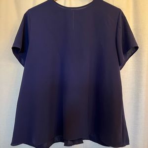 Uniqlo women’s navy shirt. Wide flare with concealed back button.